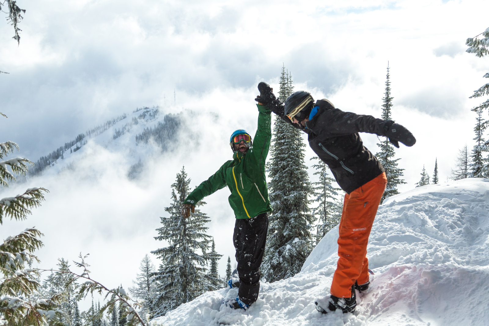 Snowboarders RED Mtn high 5